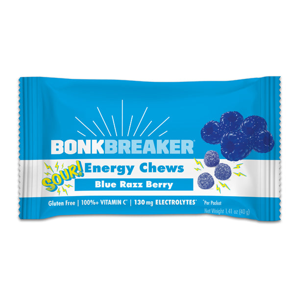 A packet of Bonk Breaker Energy Chews with Blue Razz Berry flavor, highlighting gluten-free, 100% vitamin C, and 130 mg electrolytes on the package.