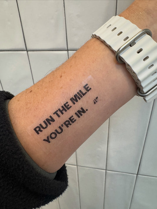 Fuel Kit temporary race tattoo on a forearm "Run the mile you're in."