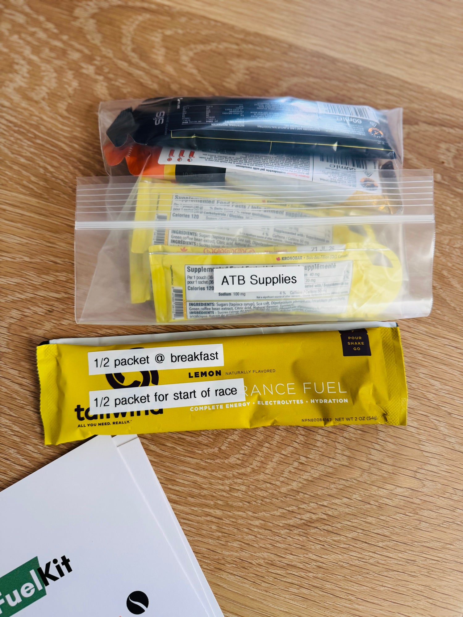 Sports gels and drinks assembled in individualized plastic bags for a Fuel Kit