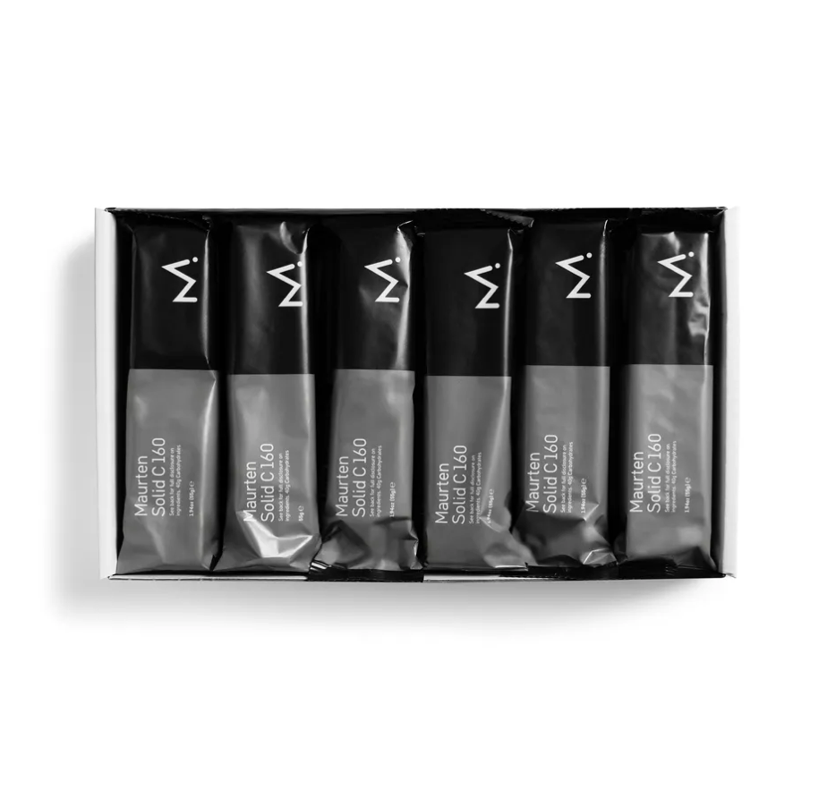 A box of 12 Maurten Solid C 160 bars neatly packaged and sealed, with the brand's logo visible on the packaging.