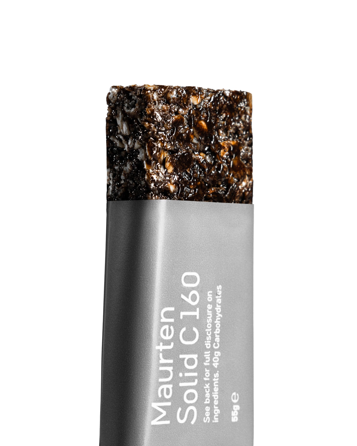 Close-up of a Maurten Solid C 160 nutrition bar with visible oats and rice crispies inside a transparent packaging.