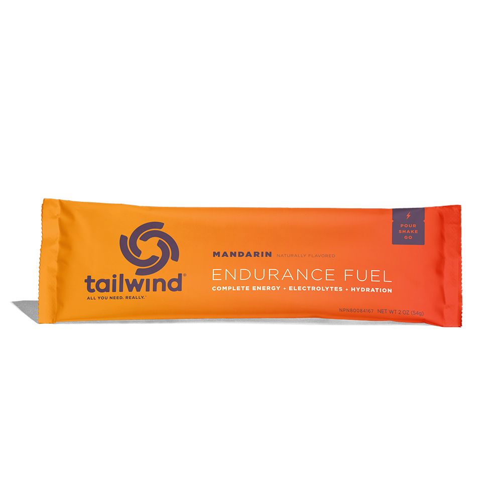 A packet of Tailwind Endurance Fuel labeled 'Mandarin' with a orange design, indicating it is a caffeine-free sports nutrition drink mix.
