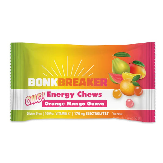 A packet of Bonk Breaker Energy Chews with OMG flavor, highlighting gluten-free, 100% vitamin C, and 130 mg electrolytes on the package.