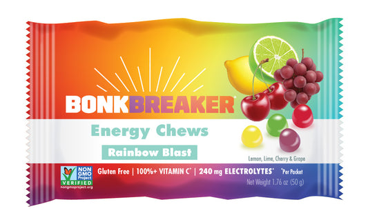 A packet of Bonk Breaker Energy Chews with Rainbow Blast flavor, highlighting gluten-free, 100% vitamin C, and 130 mg electrolytes on the package.