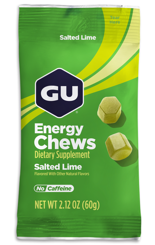 A packet of GU Energy Chews with watermelon flavor, featuring an image of sliced watermelon and the chews themselves visible through the clear window of the packaging.