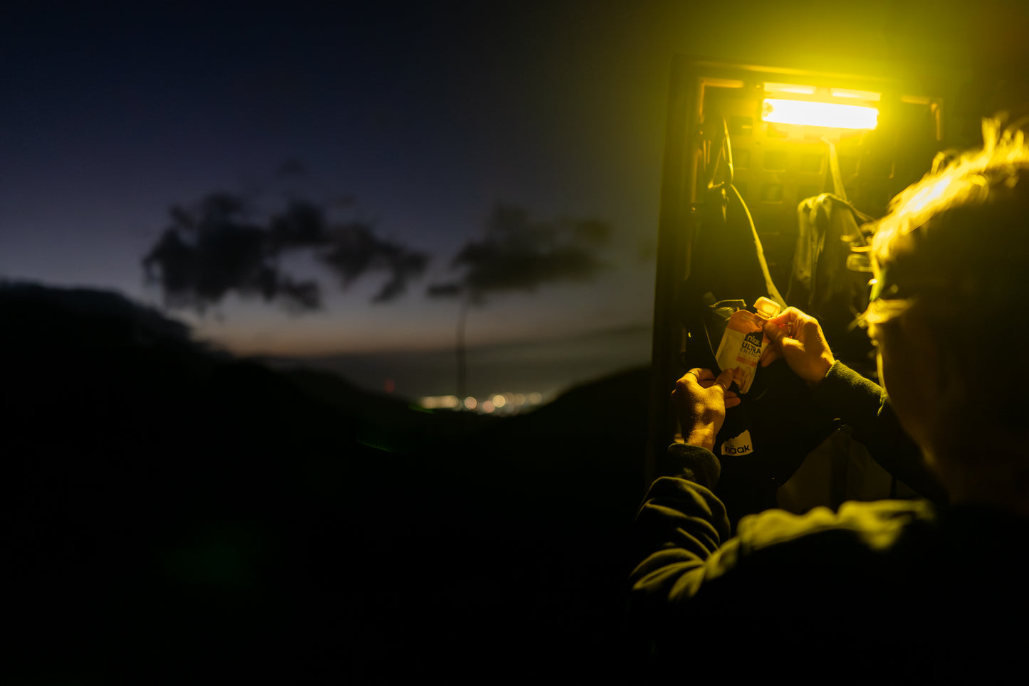 Näak Ultra Energy Pureé in the dark with a light being used for a night trail race 