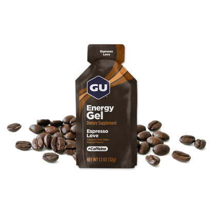 A packet of GU Energy Gel with the flavour Espresso Love  highlighted, containing 40 mg Caffeine, with images of coffee beans in the background.