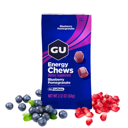 GU Energy Chews package with blueberries and pomegranate seeds on a white background