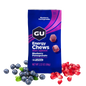 GU Energy Chews package with blueberries and pomegranate seeds on a white background