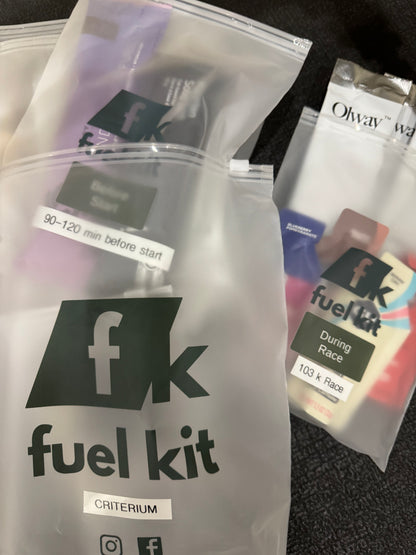 A close-up of a fuel kit organized in clear plastic zip bags on a dark textured surface available via Fuel Kit Builder.