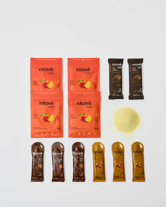 Collection of Krono products including packets and a scoop on a white background