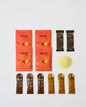 Collection of Krono products including packets and a scoop on a white background
