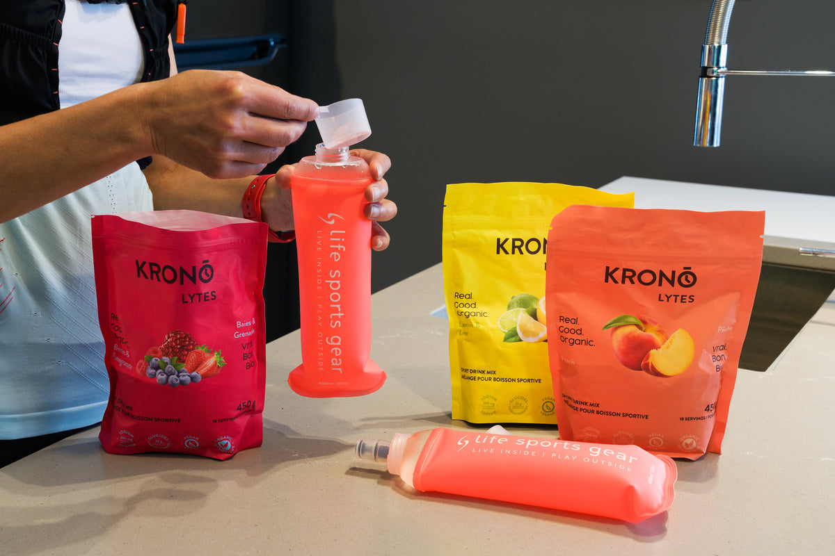 Picture of an athlete preparing Krono Lytes in a hydration flask in the kitchen | Fuel Kit