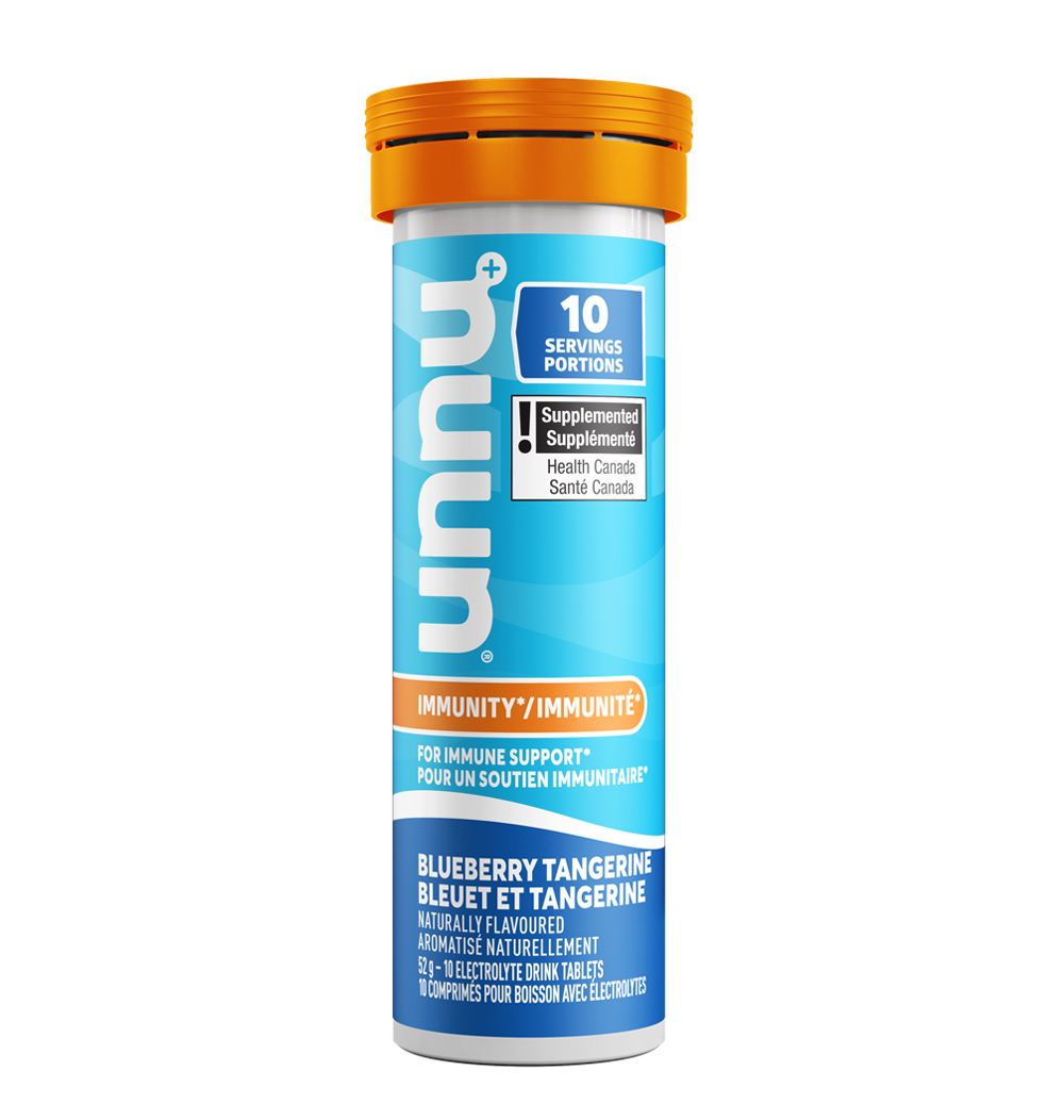Nuun Blueberry Tangerine supplement container with blue label and orange cap on a white background