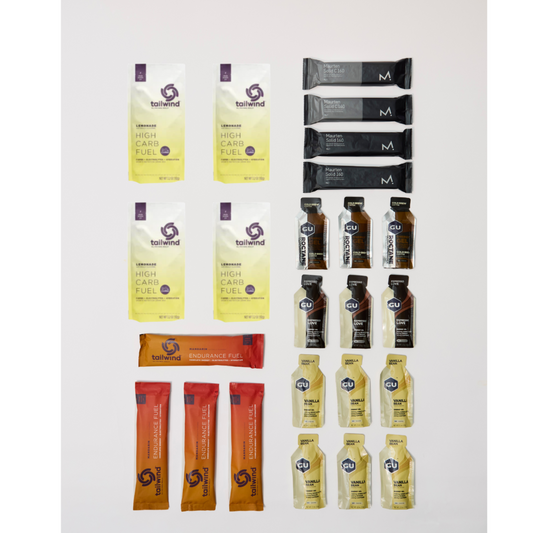 Collection of various energy drinks and fuel packets on a white background