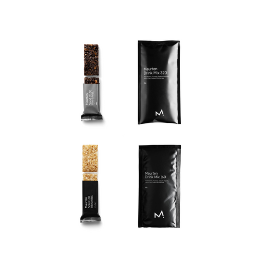 Maurten drink mix packets and solid bars on a white background