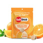 A packet of SaltStick FastChews with orange flavor, featuring the product's name and benefits, surrounded by images of oranges.