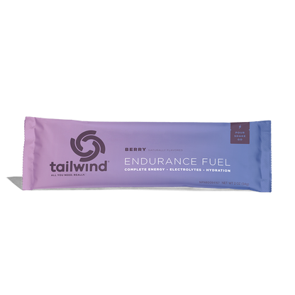 A packet of Tailwind Endurance Fuel labeled 'Berry' with a purple and white design, indicating it is a caffeine-free sports nutrition drink mix.