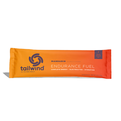 A packet of Tailwind Endurance Fuel labeled 'Mandarin' with a orange design, indicating it is a caffeine-free sports nutrition drink mix.