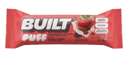 A single Built Puff protein bar wrapper in red, in the flavor 'Strawberries - N Cream', available at Fuel Kit