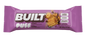 A purple wrapper for a Built Puff Churro protein bar, available at Fuel Kit.